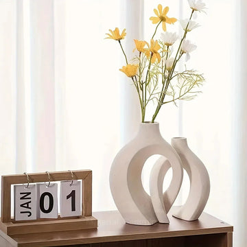 Elevate your home décor with the Snuggle Hollow Ceramic Vase Set of 2 Nordic, a timeless combination of minimalist design and modern elegance.